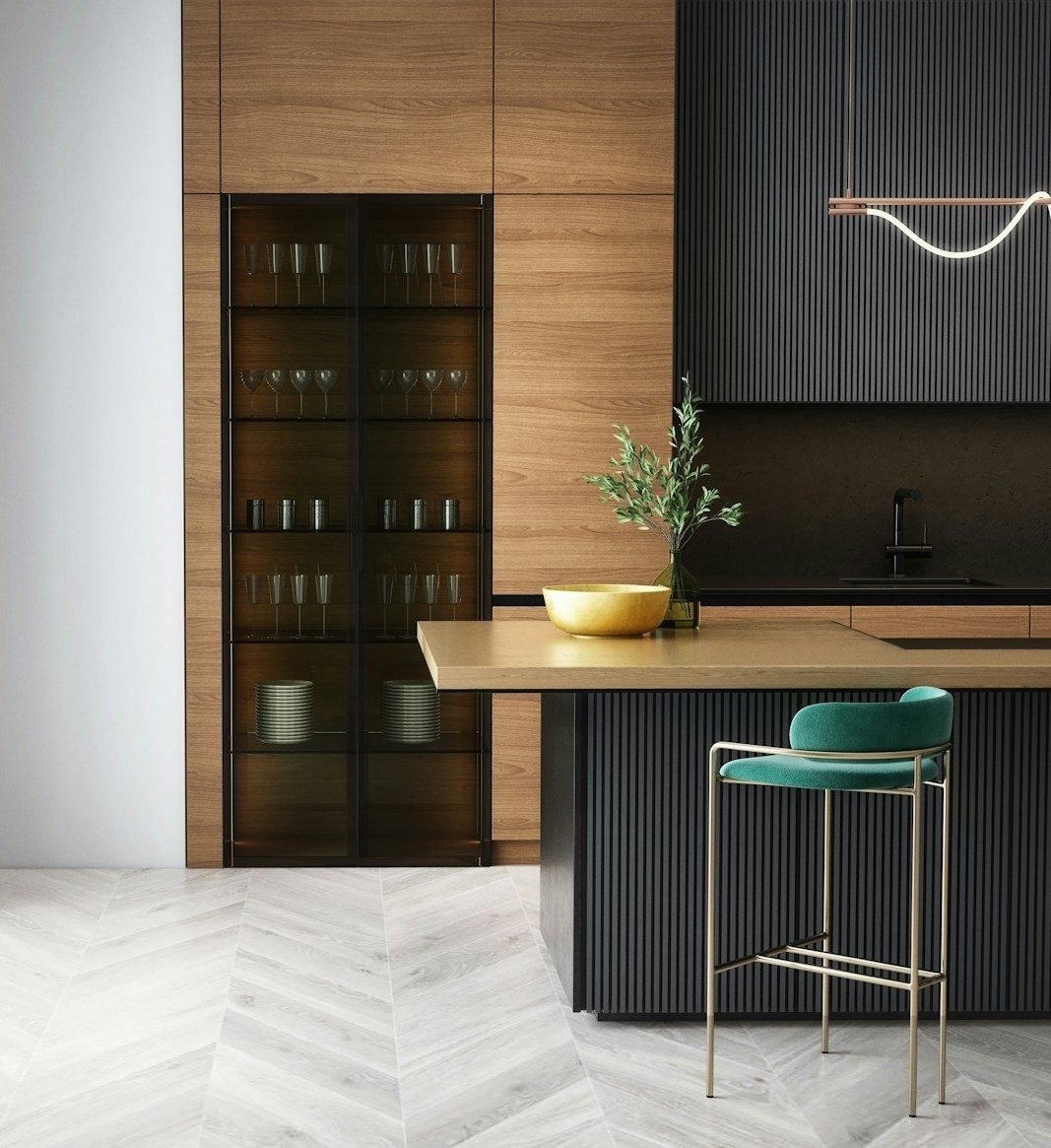 Dark timber kitchen with brass detailing